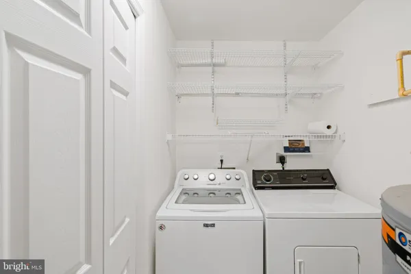 a view of a balcony with wooden floor and fence