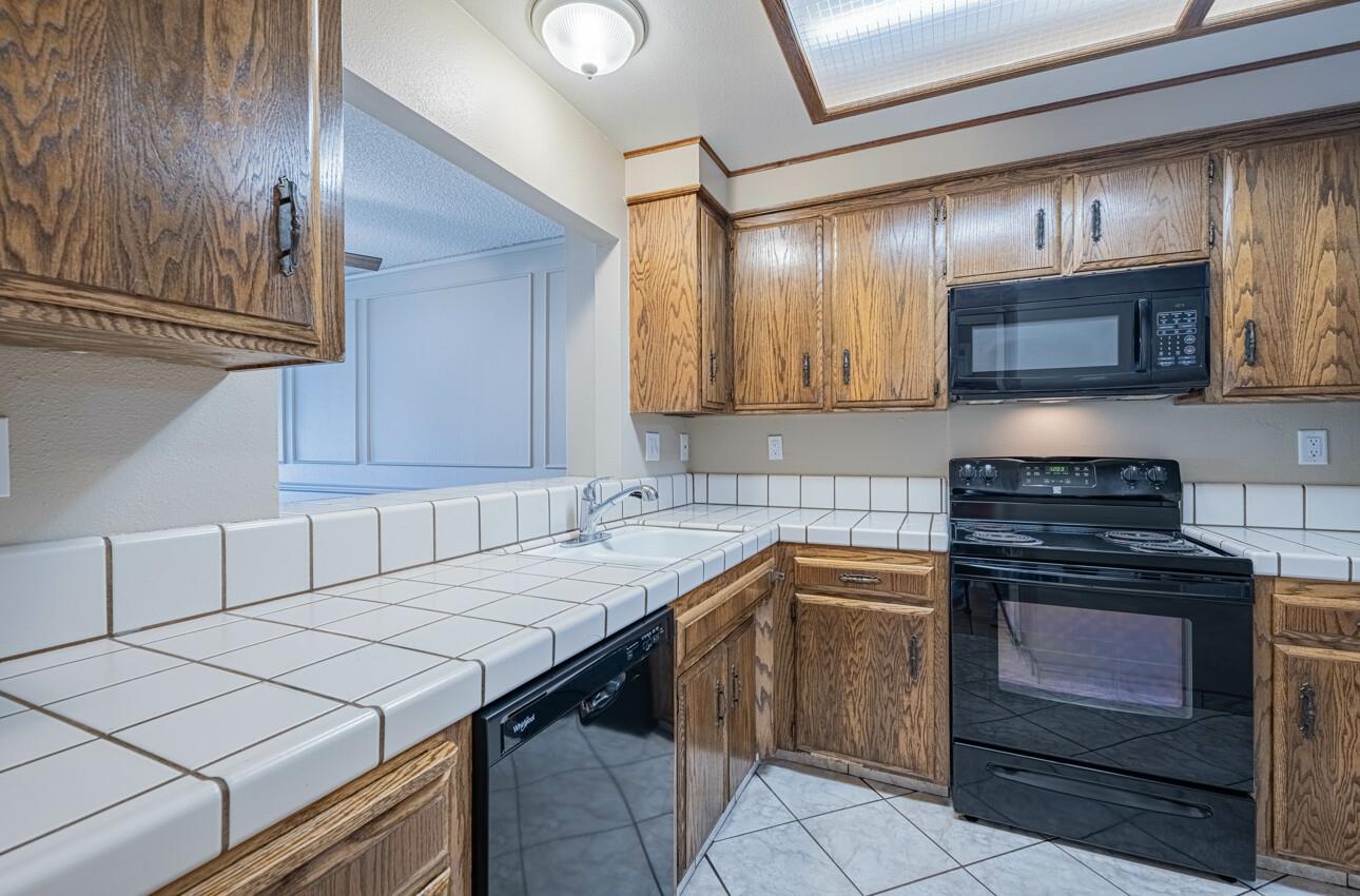 1840 Cherokee Drive, Unit 1 Salinas, CA 93906 - Photo 14 of 32 a kitchen with a stove sink and cabinets