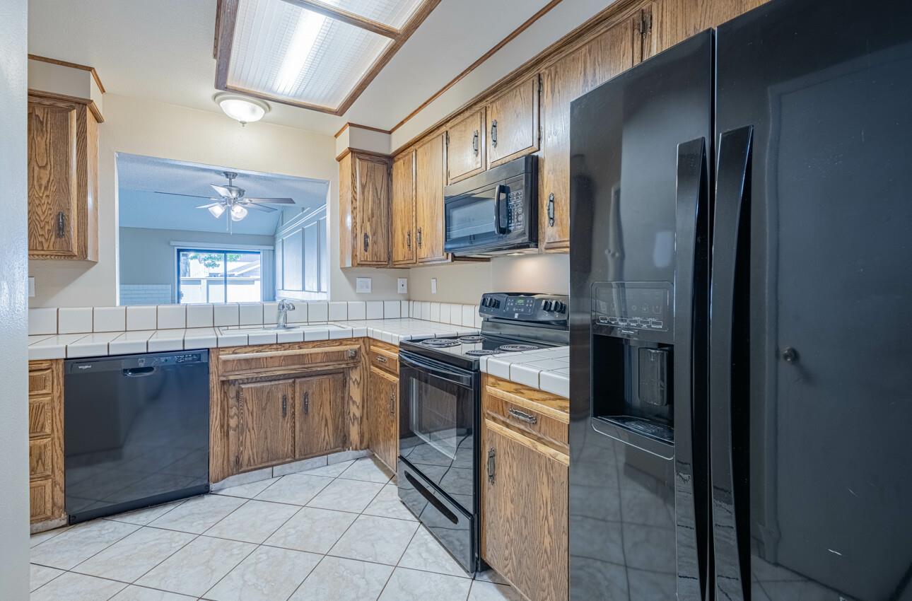 1840 Cherokee Drive, Unit 1 Salinas, CA 93906 - Photo 16 of 32 a large kitchen with stainless steel appliances granite countertop a refrigerator and a sink