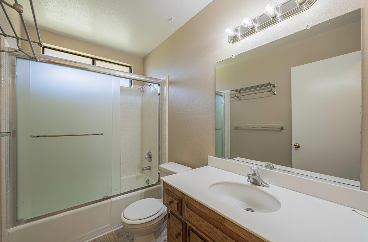 1840 Cherokee Drive, Unit 1 Salinas, CA 93906 - Photo 28 of 32 a bathroom with a sink toilet and shower