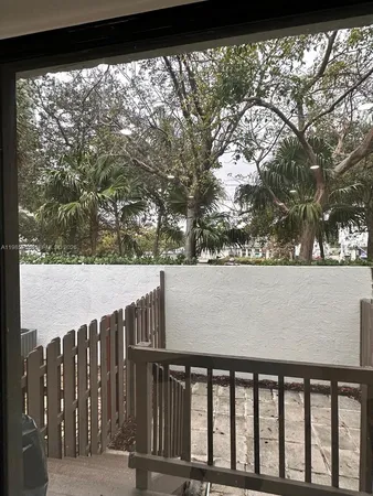 a view of balcony and yard