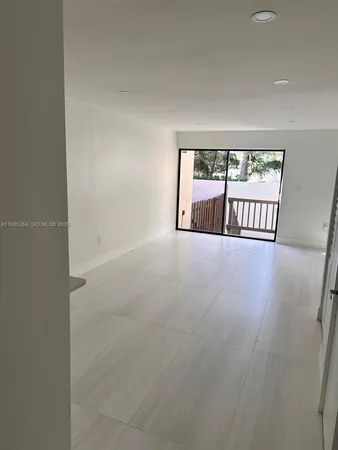 an empty room with large window