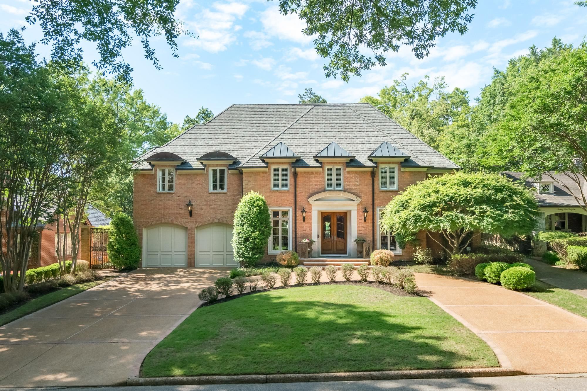 a front view of a house with yard