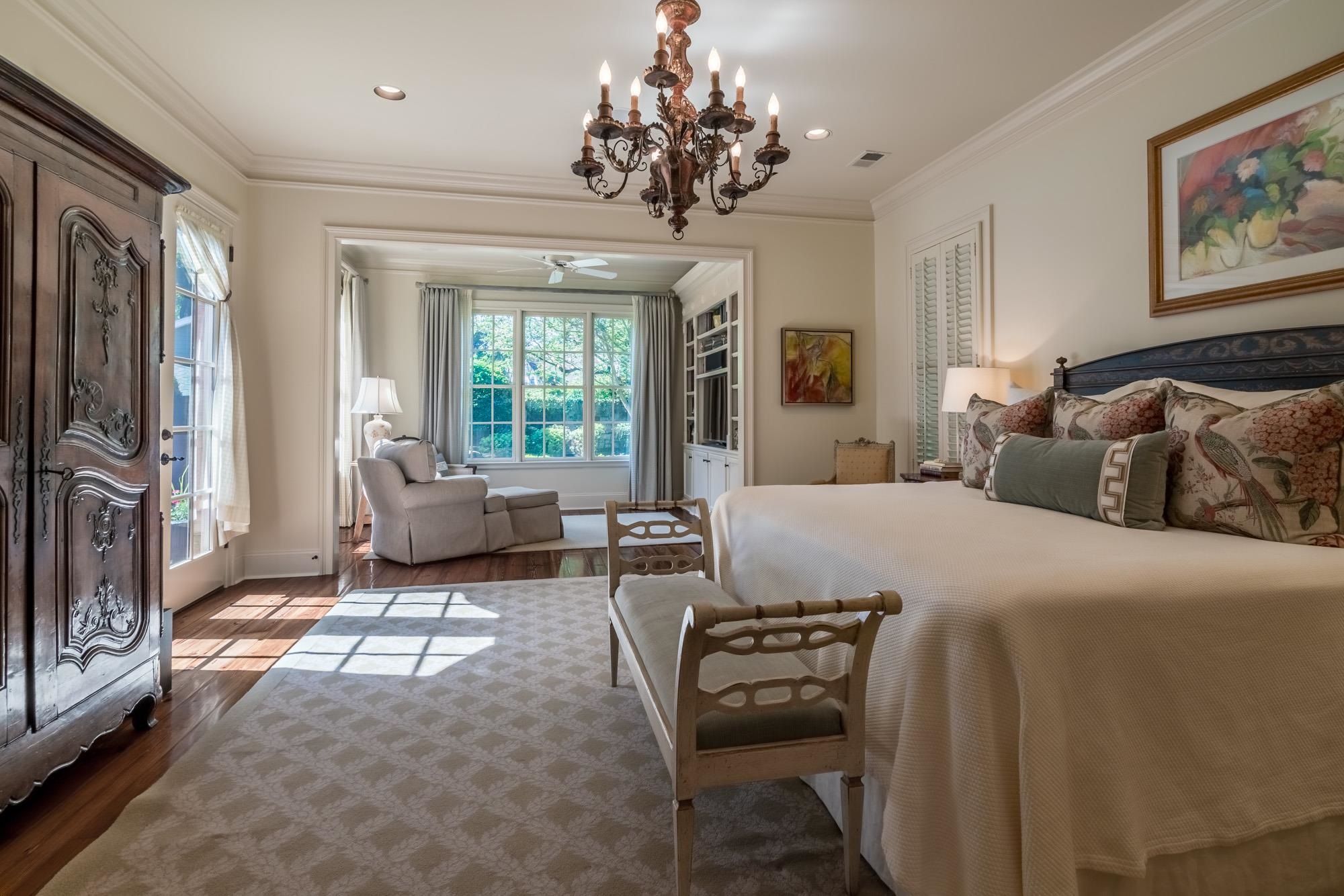 2951 Iroquois Road Memphis, TN 38111 - Photo 11 of 24 a spacious bedroom with a bed and a chandelier