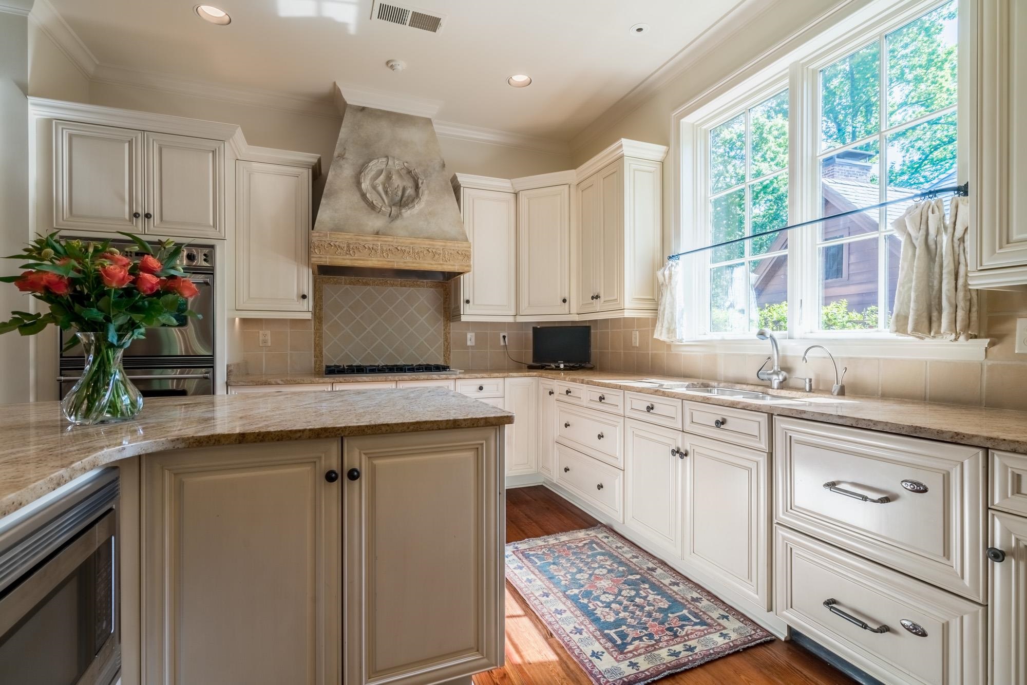 2951 Iroquois Road Memphis, TN 38111 - Photo 7 of 24 a kitchen with granite countertop a stove a sink and a window