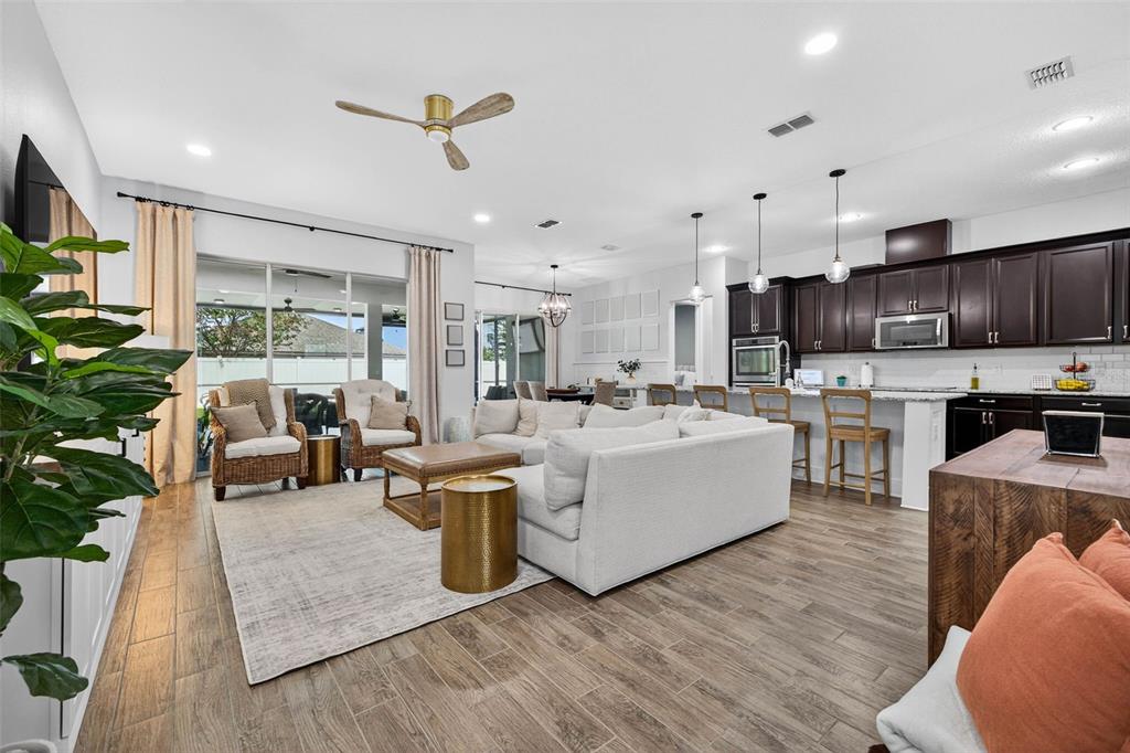 10522 Cardera Drive Riverview, FL 33578 - Photo 11 of 43 a living room with furniture kitchen view and a large window