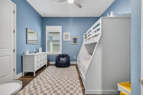 a bathroom with a bathtub sink and mirror