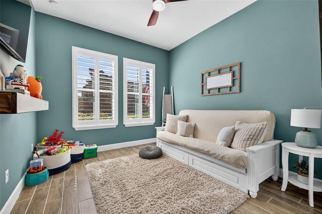 10522 Cardera Drive Riverview, FL 33578 - Photo 26 of 43 a living room with furniture and a large window