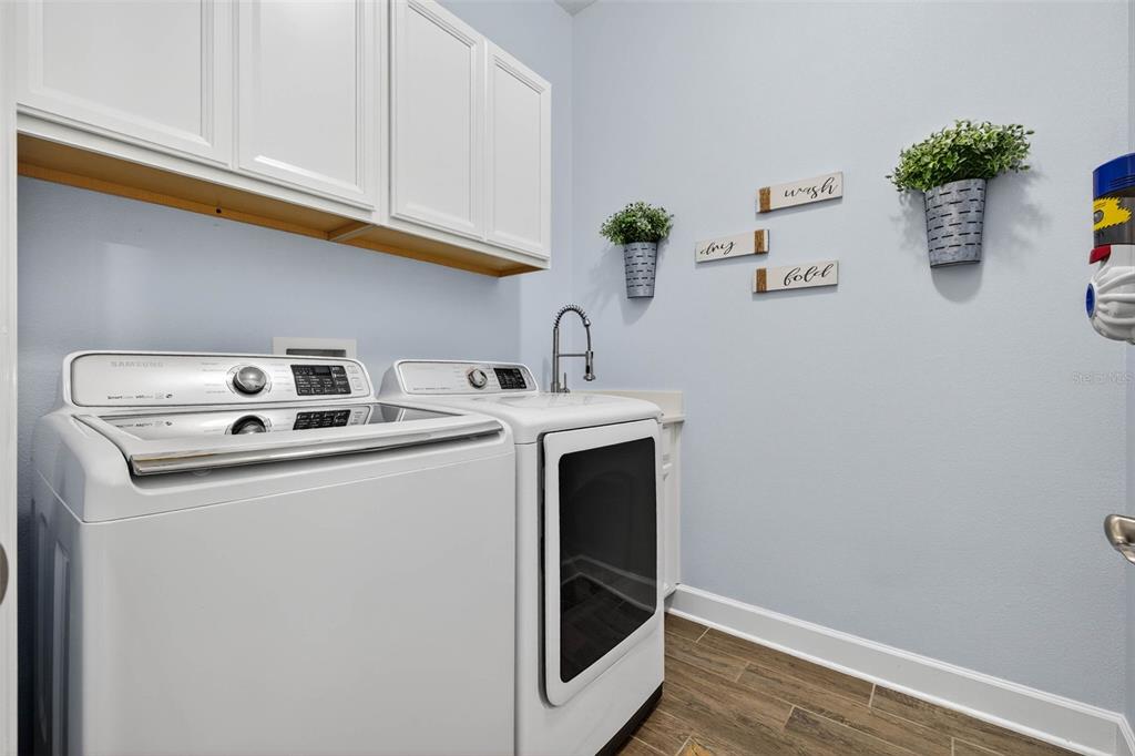 10522 Cardera Drive Riverview, FL 33578 - Photo 28 of 43 a utility room with dryer and washer