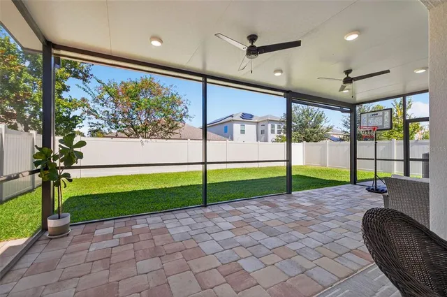 a view of swimming pool with an outdoor seating space