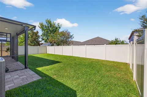 a view of a backyard with a garden and plants