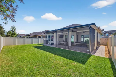 a view of a house with a backyard