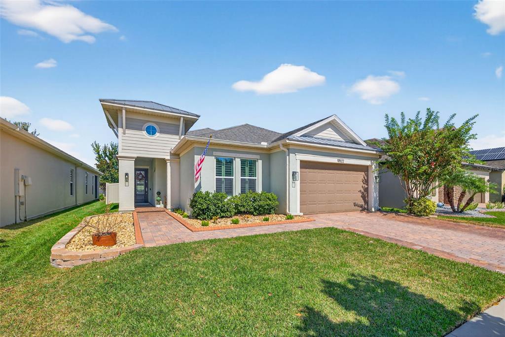 10522 Cardera Drive Riverview, FL 33578 - Photo 36 of 43 a front view of a house with a garden and yard