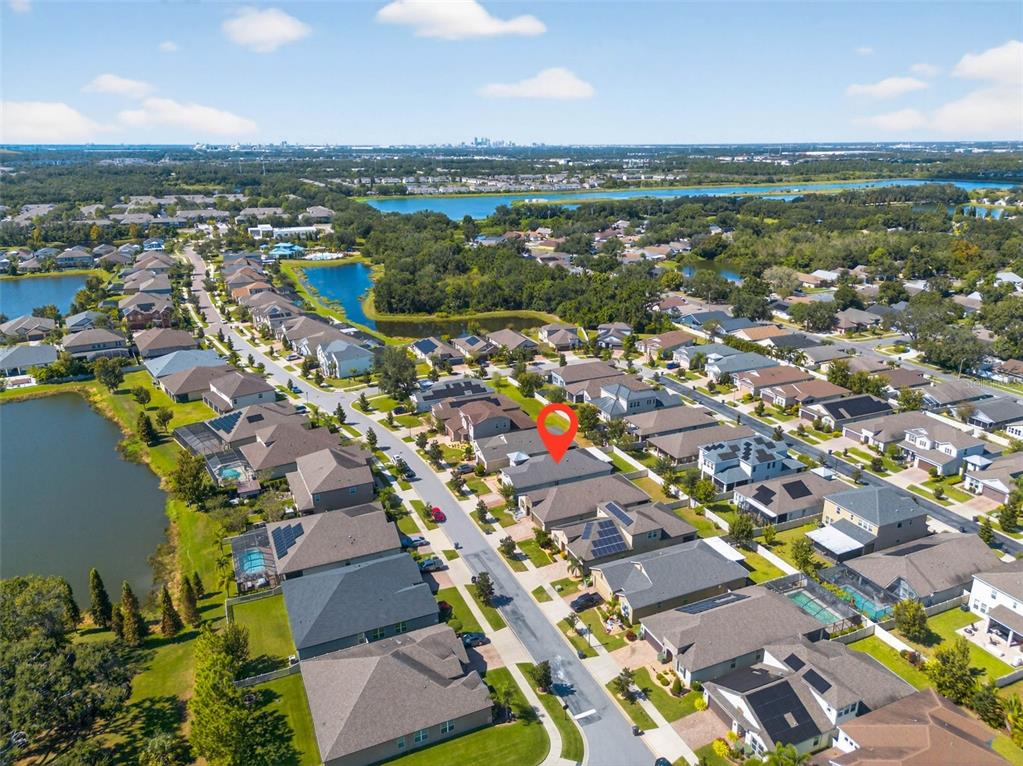 10522 Cardera Drive Riverview, FL 33578 - Photo 38 of 43 an aerial view of a city with lots of residential buildings and mountain view in back