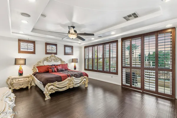 a kitchen that has a lot of cabinets and wooden floor