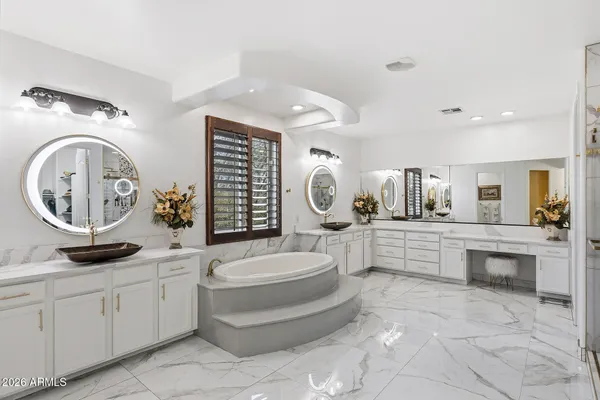 a bedroom with furniture and wooden floor