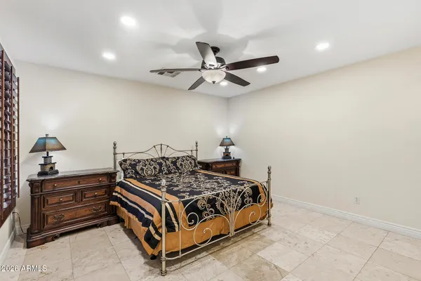 a bathroom with a toilet a sink and a mirror