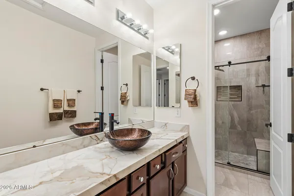 a living room with furniture and a ceiling fan