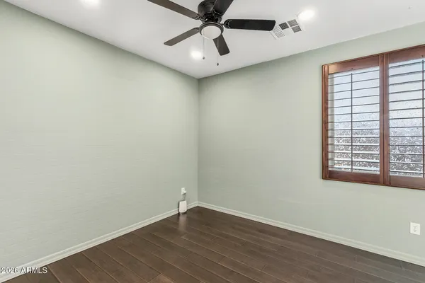 a bathroom with a shower and toilet