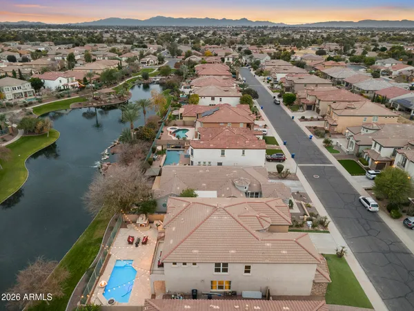 an aerial view of a house with a big yard