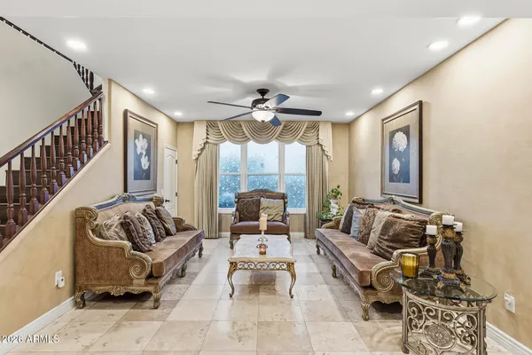 a kitchen with a refrigerator a stove top oven and kitchen island