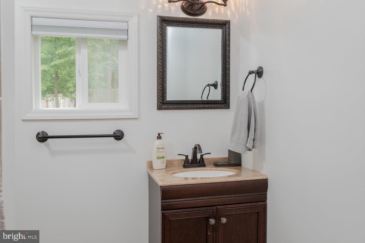 159 Park View Shenandoah, VA 22849 - Photo 19 of 66 a bathroom with a sink a mirror and a window