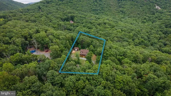 a view of balcony with wooden floor and fence