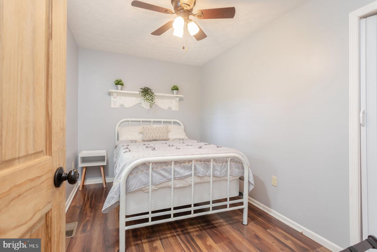 159 Park View Shenandoah, VA 22849 - Photo 21 of 66 a bedroom with a bed and a chandelier fan