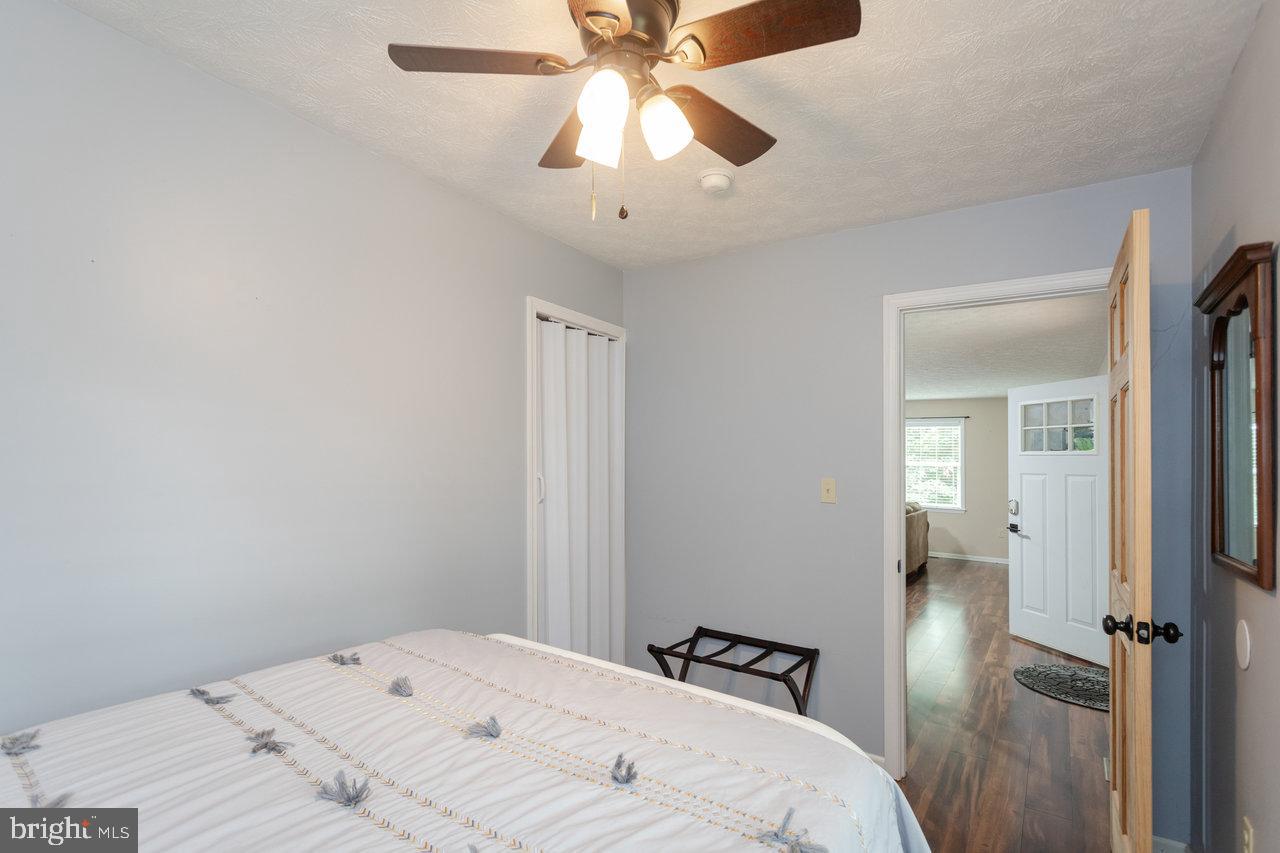 159 Park View Shenandoah, VA 22849 - Photo 24 of 66 a bedroom with a bed and a chandelier