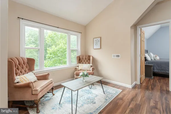 a bedroom with a bed and a couch
