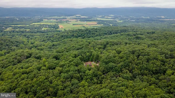 a view of balcony with furniture and umbrella