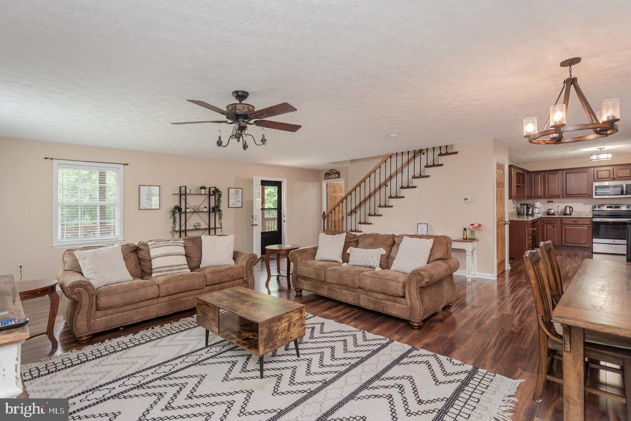 159 Park View Shenandoah, VA 22849 - Photo 8 of 66 a living room with furniture a fireplace and a chandelier