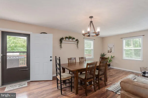 a kitchen with granite countertop stainless steel appliances and wooden cabinets