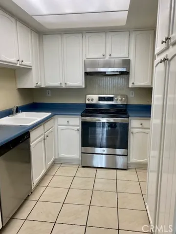 a view of an empty room and a window