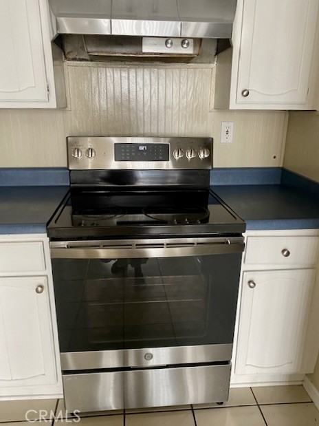 8105 Redlands Street, Unit 107 Playa del Rey, CA 90293 - Photo 16 of 43 a stove top oven sitting inside of a kitchen