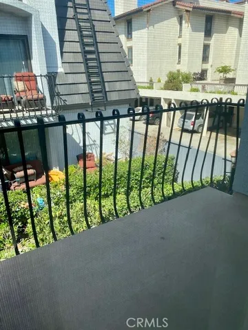 a white toilet sitting next to a bath tub