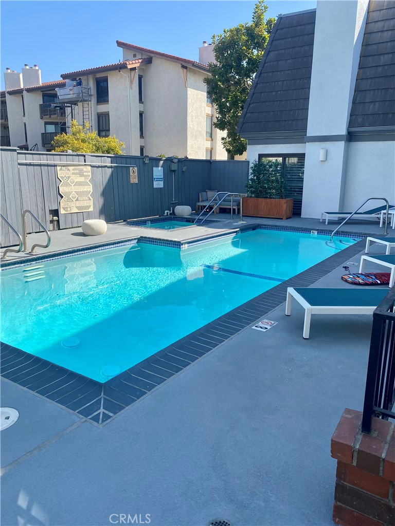 8105 Redlands Street, Unit 107 Playa del Rey, CA 90293 - Photo 3 of 43 a view of a house with a swimming pool