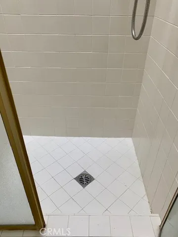 a bathroom with a granite countertop sink a toilet and a mirror
