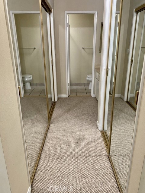 8105 Redlands Street, Unit 107 Playa del Rey, CA 90293 - Photo 8 of 43 a view of a hallway with a room and a toilet