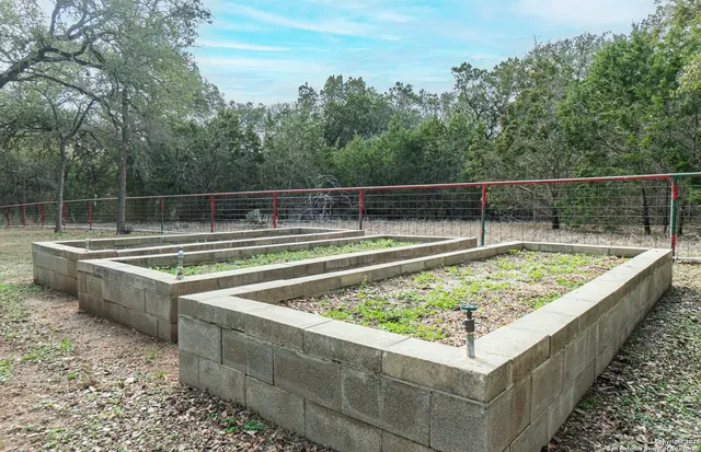 a view of a pool with a outdoor seating