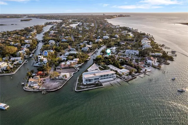 an aerial view of a house with a ocean view