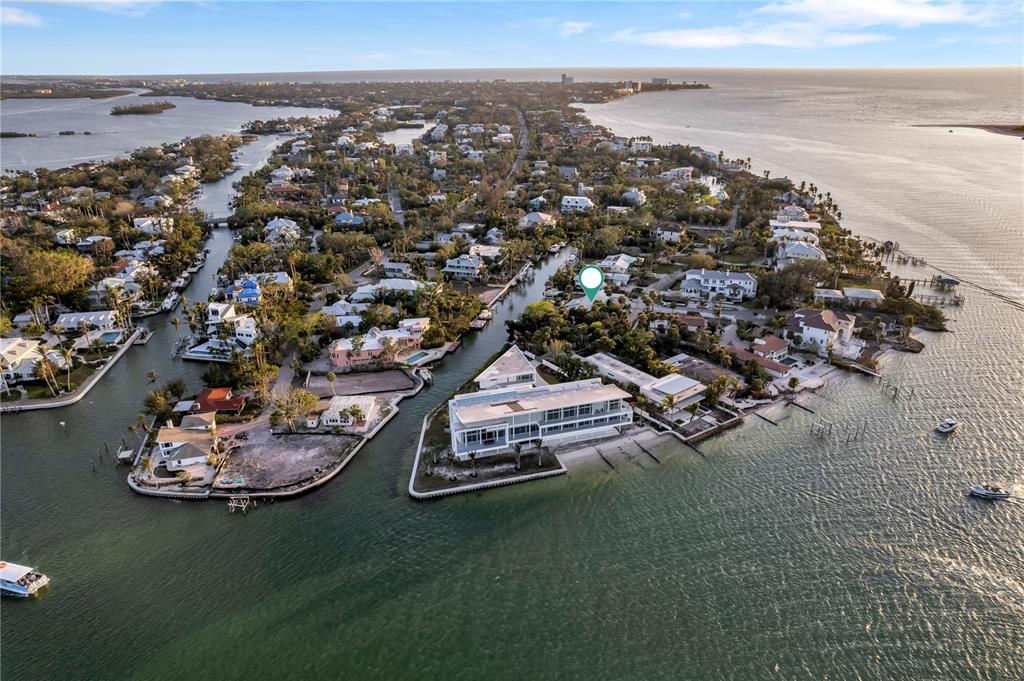 31 Lands End Lane Sarasota, FL 34242 - Photo 3 of 49 an aerial view of a house with a ocean view