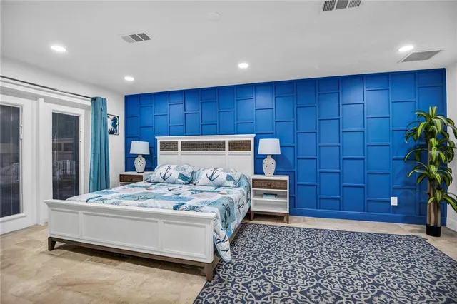 a bedroom with a bed and a dresser