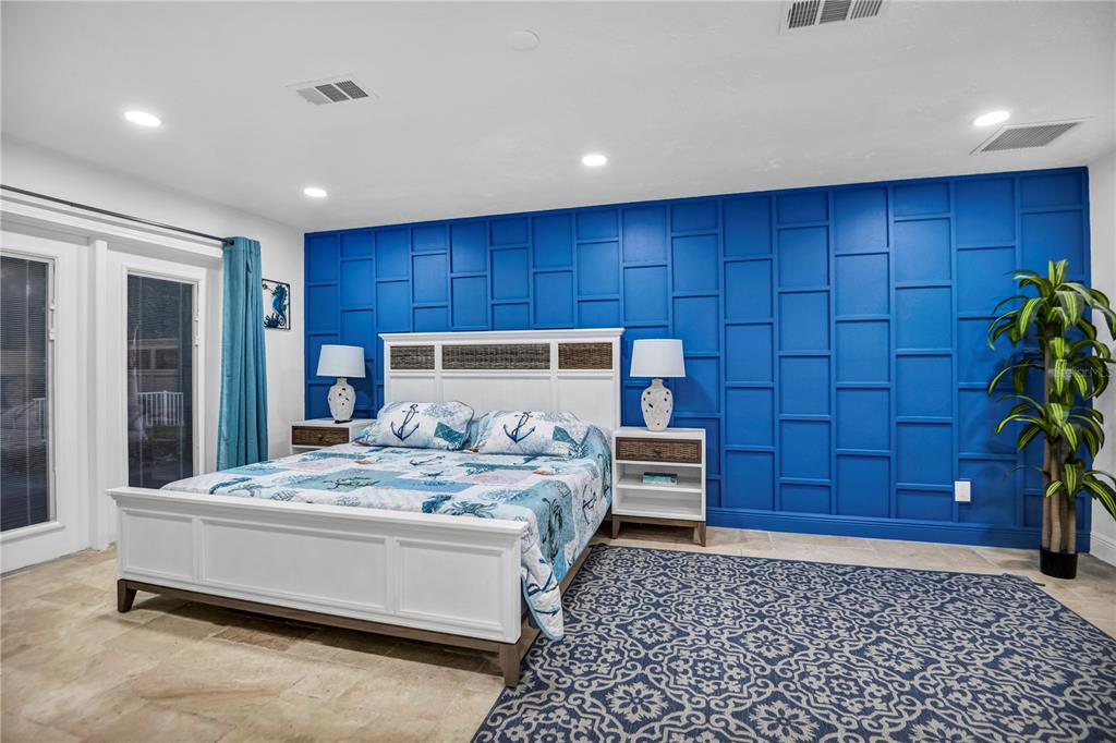 31 Lands End Lane Sarasota, FL 34242 - Photo 32 of 49 a bedroom with a bed and a dresser