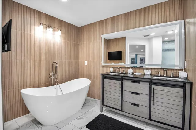a bathroom with a bathtub and a sink