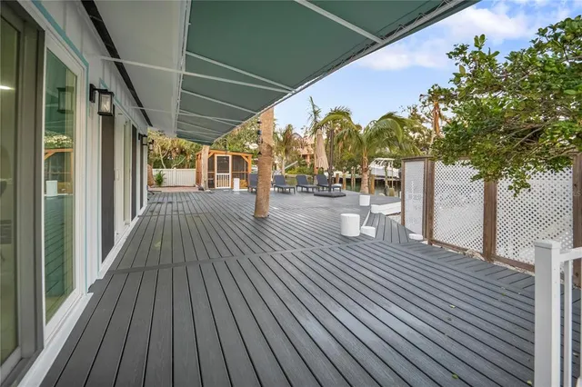 a view of a balcony with wooden floor