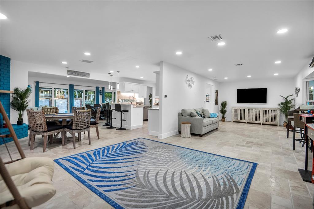 31 Lands End Lane Sarasota, FL 34242 - Photo 8 of 49 a living room with furniture and a table