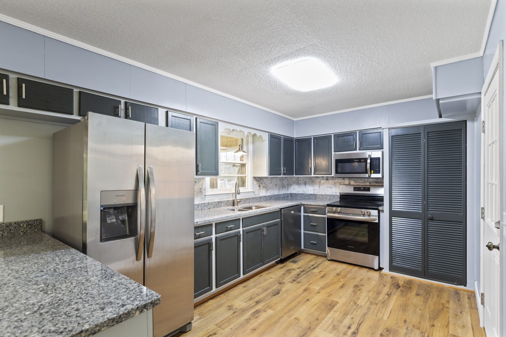 104 Doyle Drive Seneca, SC 29678 - Photo 2 of 19 This modern kitchen features stainless steel appliances and ample counter space for daily living.