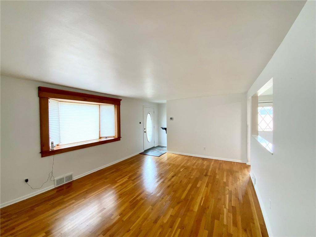 86 Thorncrest Drive McKees Rocks, PA 15136 - Photo 6 of 25 Living Room with Gleaming Hard Wood Floors and Bay Window.
