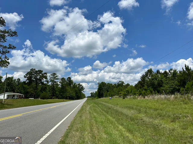 a view of a city street with a houses